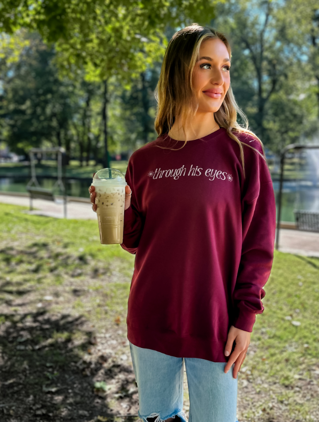 model wearing Through His Eyes Sweatshirt