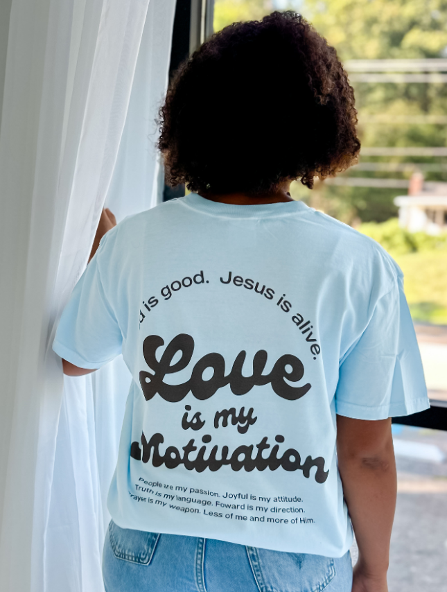 model wearing Love Is My Motivation Tee