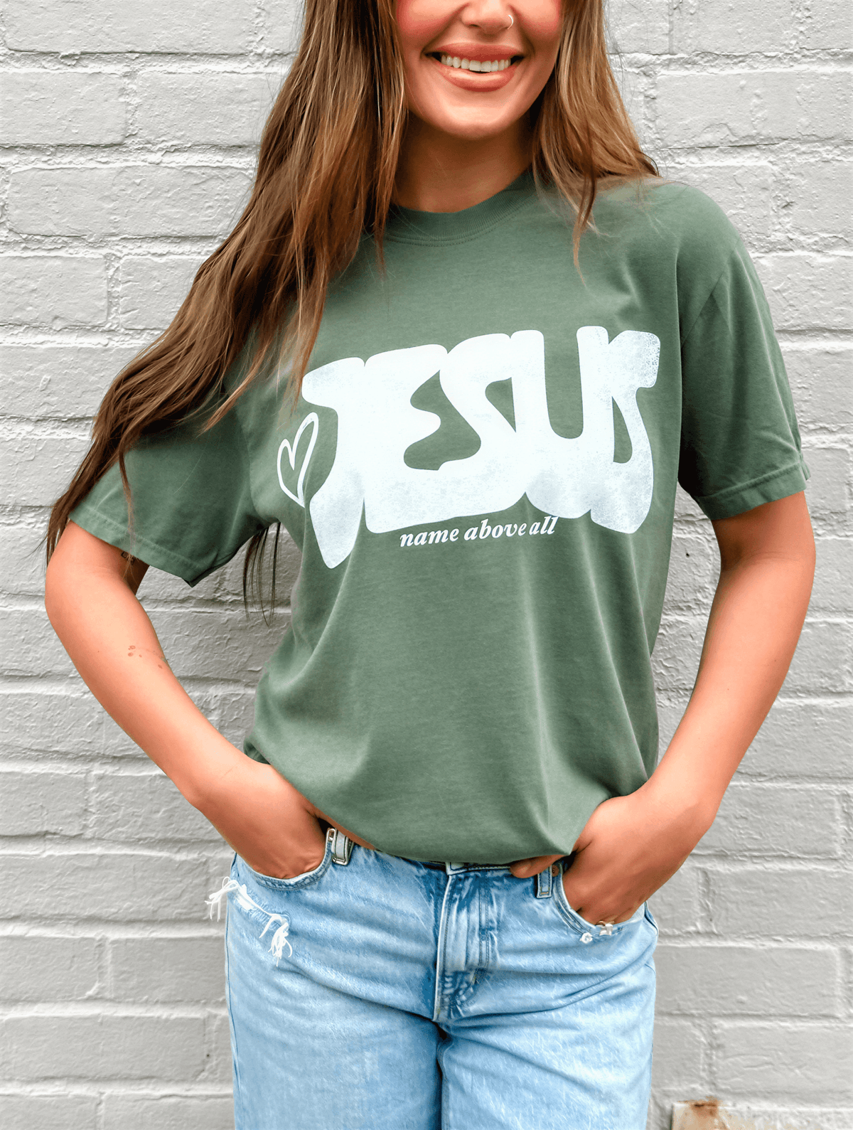 model wearing Name Above All Tee