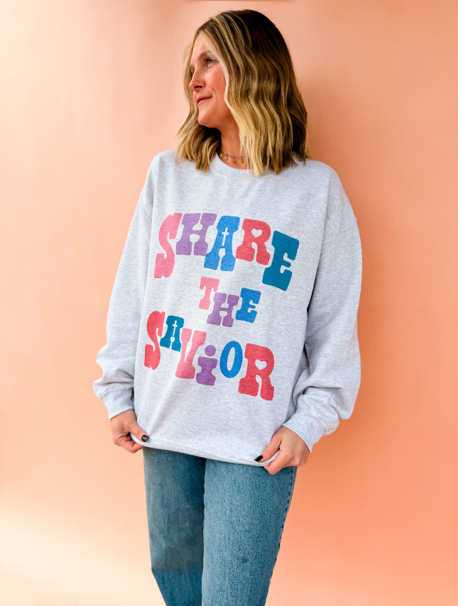 model wearing Share The Savior Sweatshirt