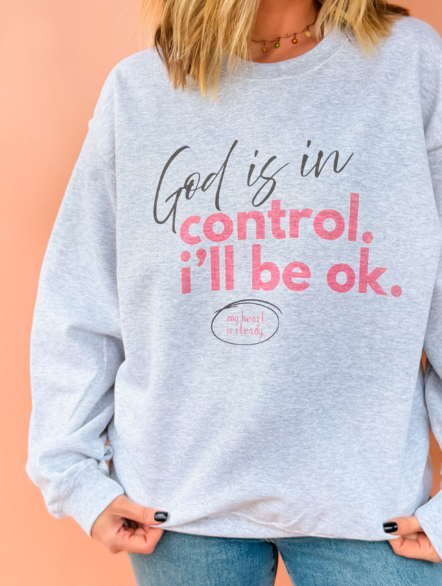 model wearing God Is In Control Sweatshirt