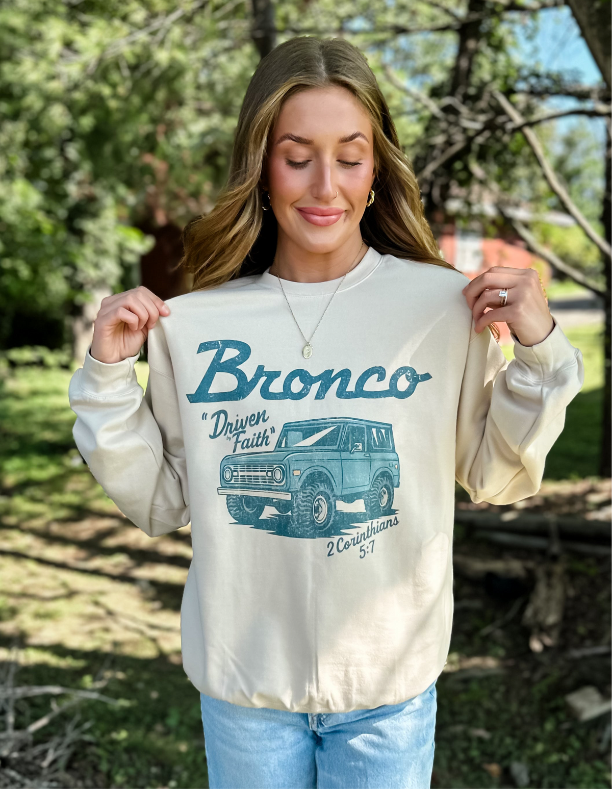 model wearing Driven By Faith Bronco Sweatshirt