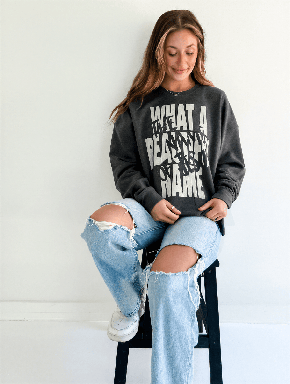 model wearing What A Beautiful Name Sweatshirt