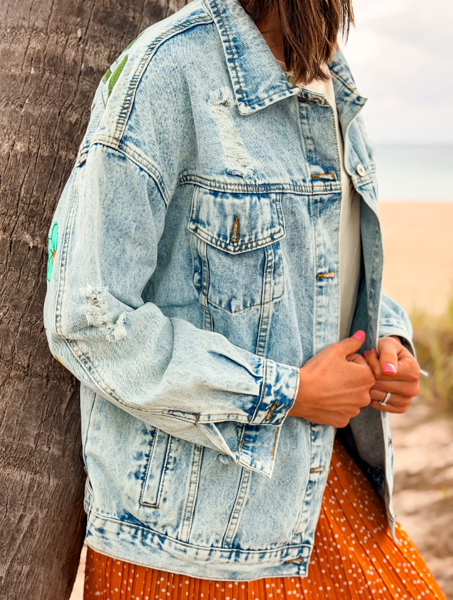 model wearing custom painted denim jacket