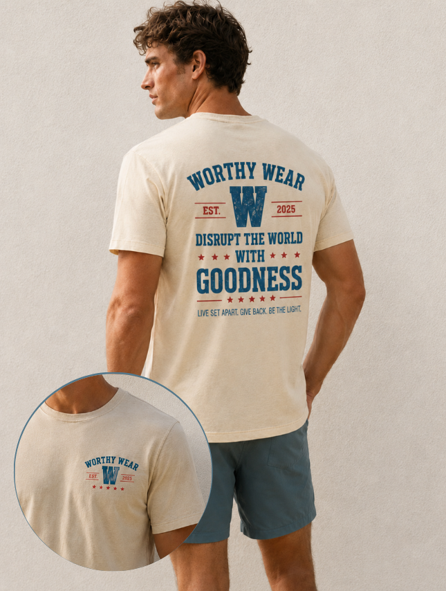 Cream vintage Goodness tee featuring a graphic print on the back and a smaller logo on the front, worn by a model.