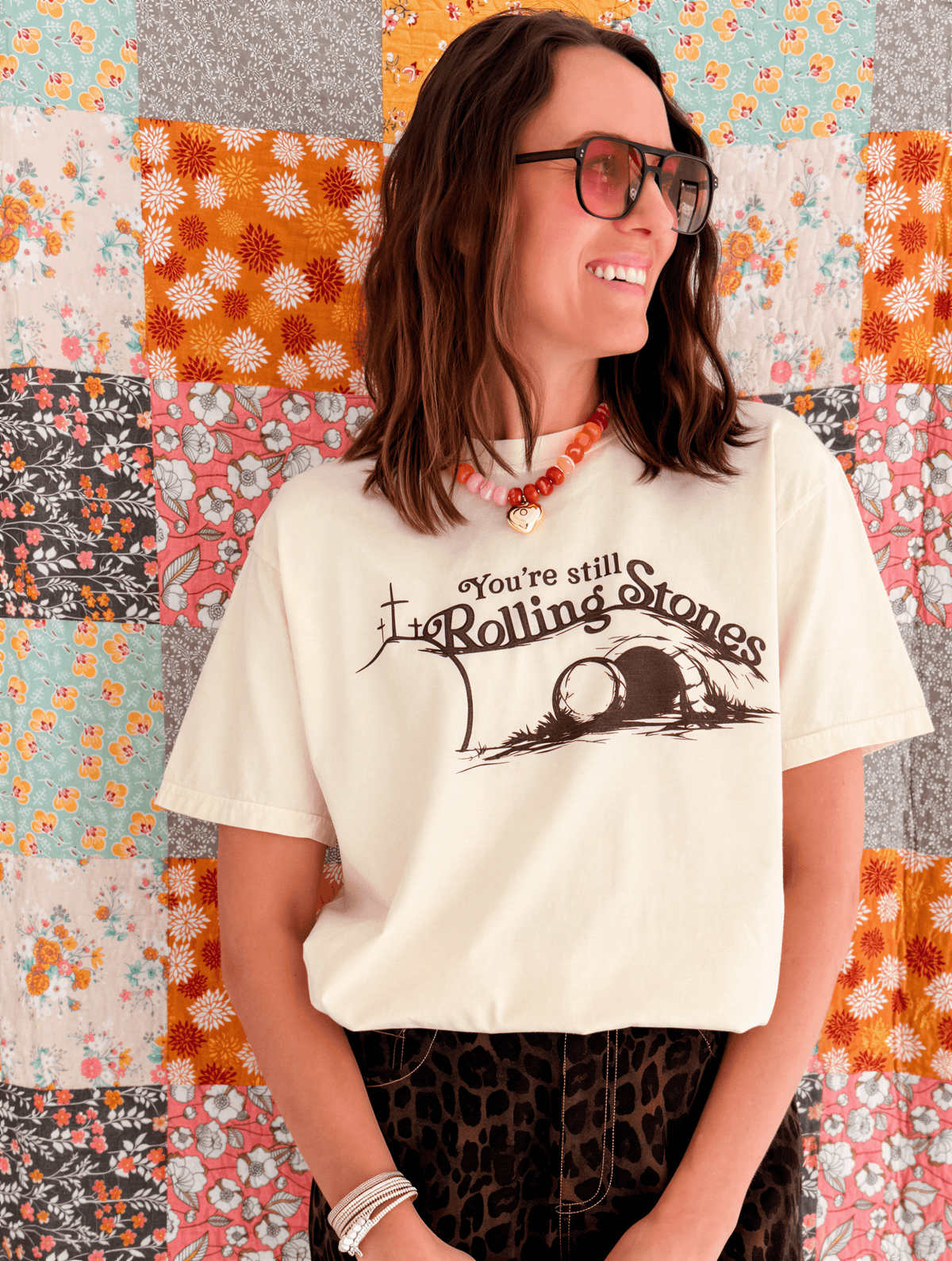 model wearing you're still rolling stones tee