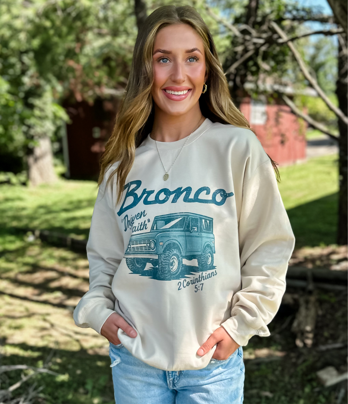 model wearing Driven By Faith Bronco Sweatshirt