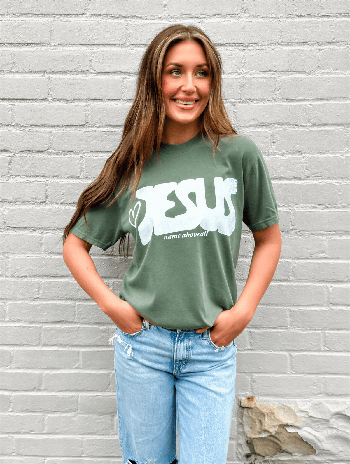 model wearing Name Above All Tee