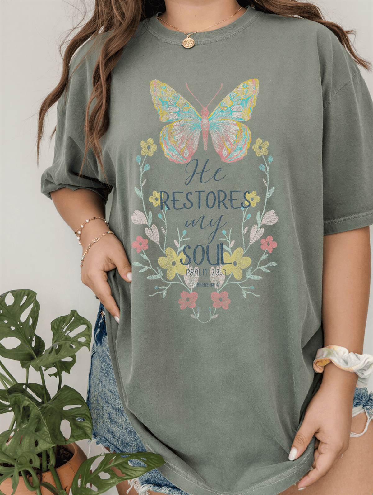 model wearing he restores my soul tee