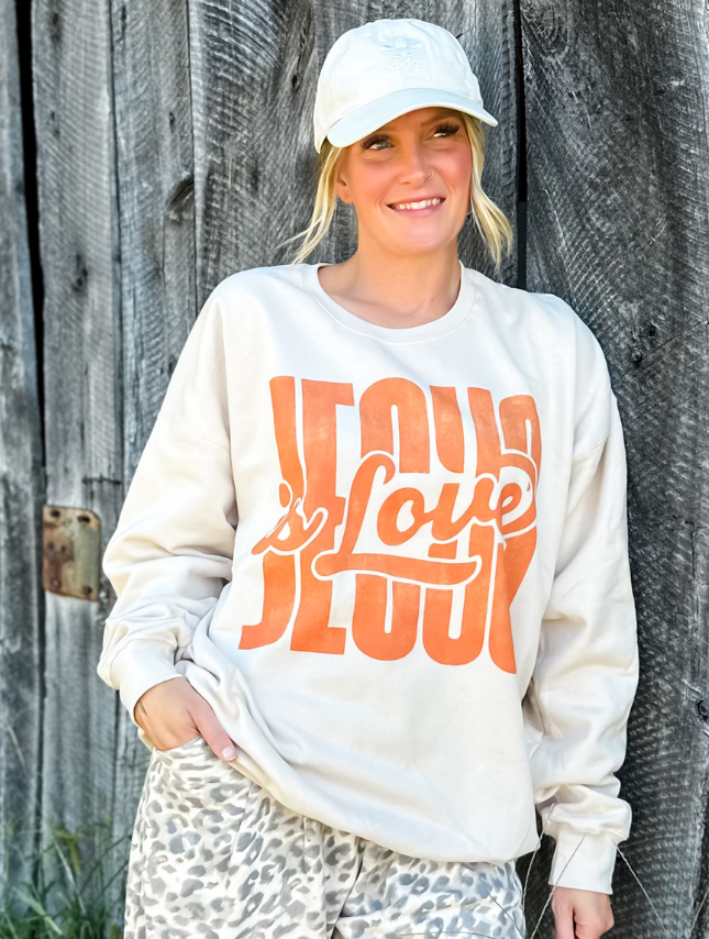 model wearing Jesus Is Love Sweatshirt