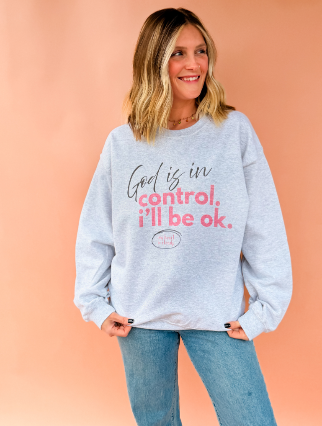 model wearing God Is In Control Sweatshirt