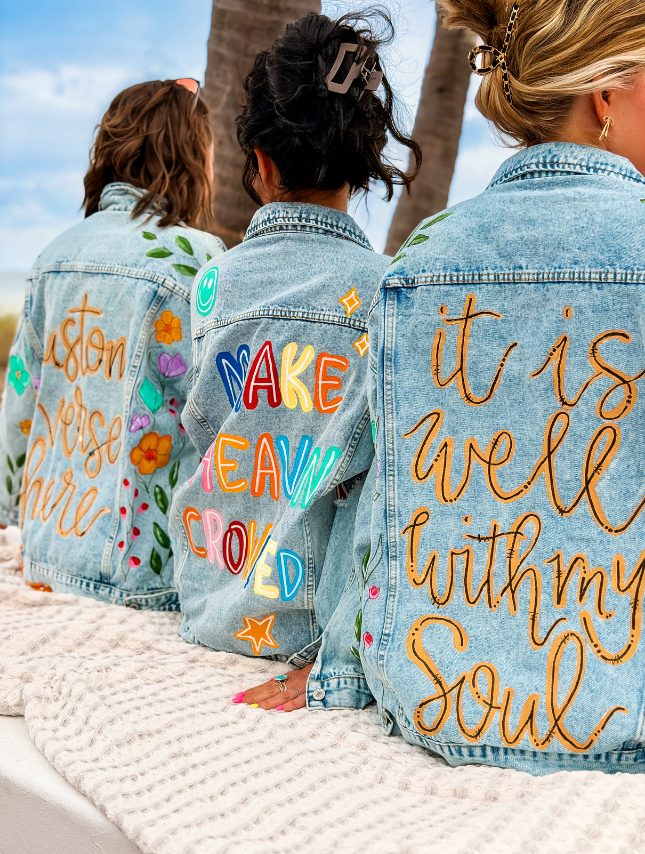 model wearing custom painted denim jacket
