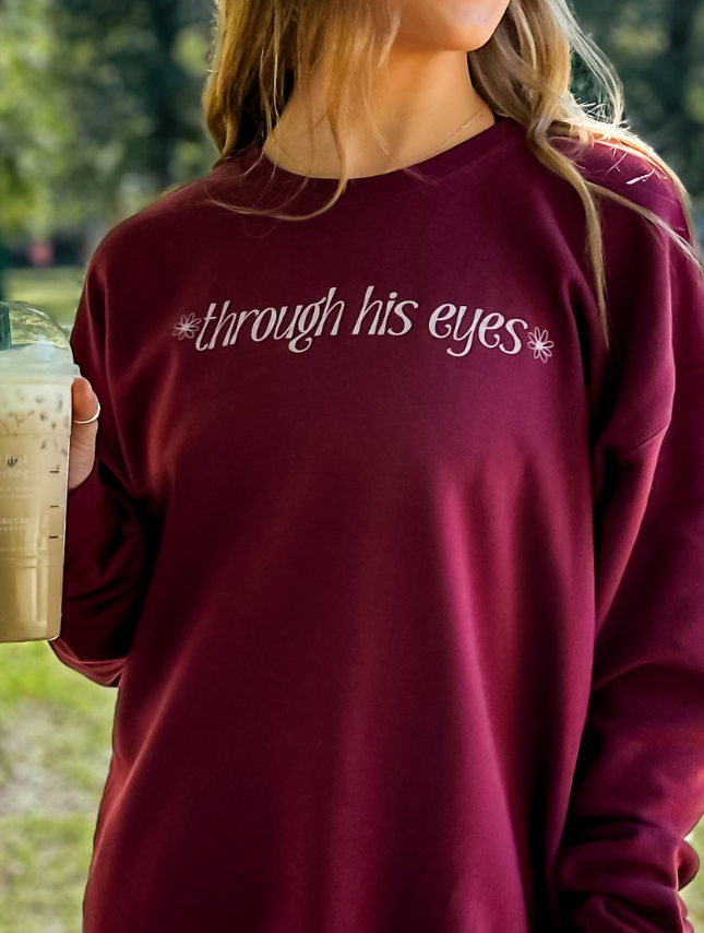 model wearing Through His Eyes Sweatshirt