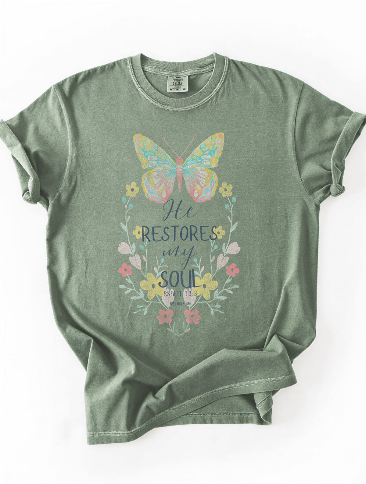 flat lay of he restores my soul tee