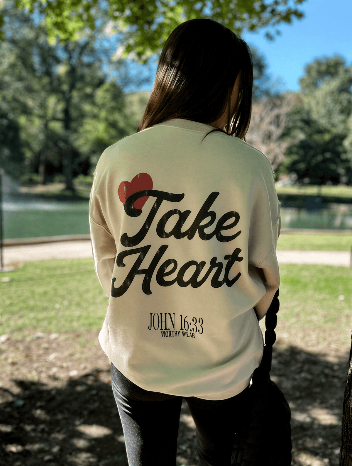 model wearing Take Heart Sweatshirt