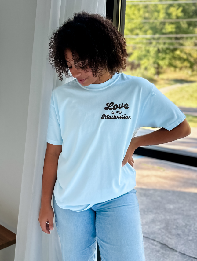 model wearing Love Is My Motivation Tee