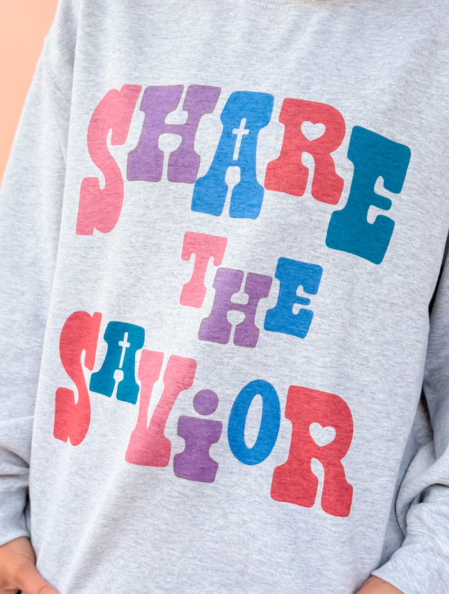 model wearing Share The Savior Sweatshirt