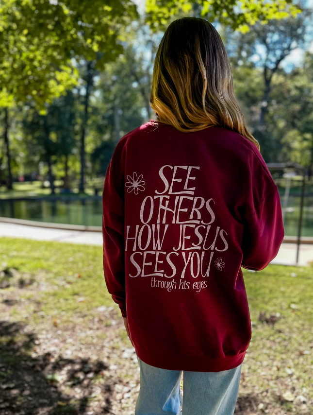 model wearing Through His Eyes Sweatshirt