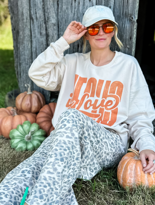 model wearing Jesus Is Love Sweatshirt
