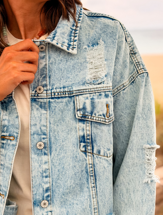 model wearing custom painted denim jacket