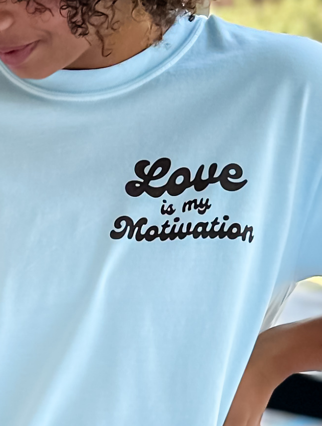 model wearing Love Is My Motivation Tee
