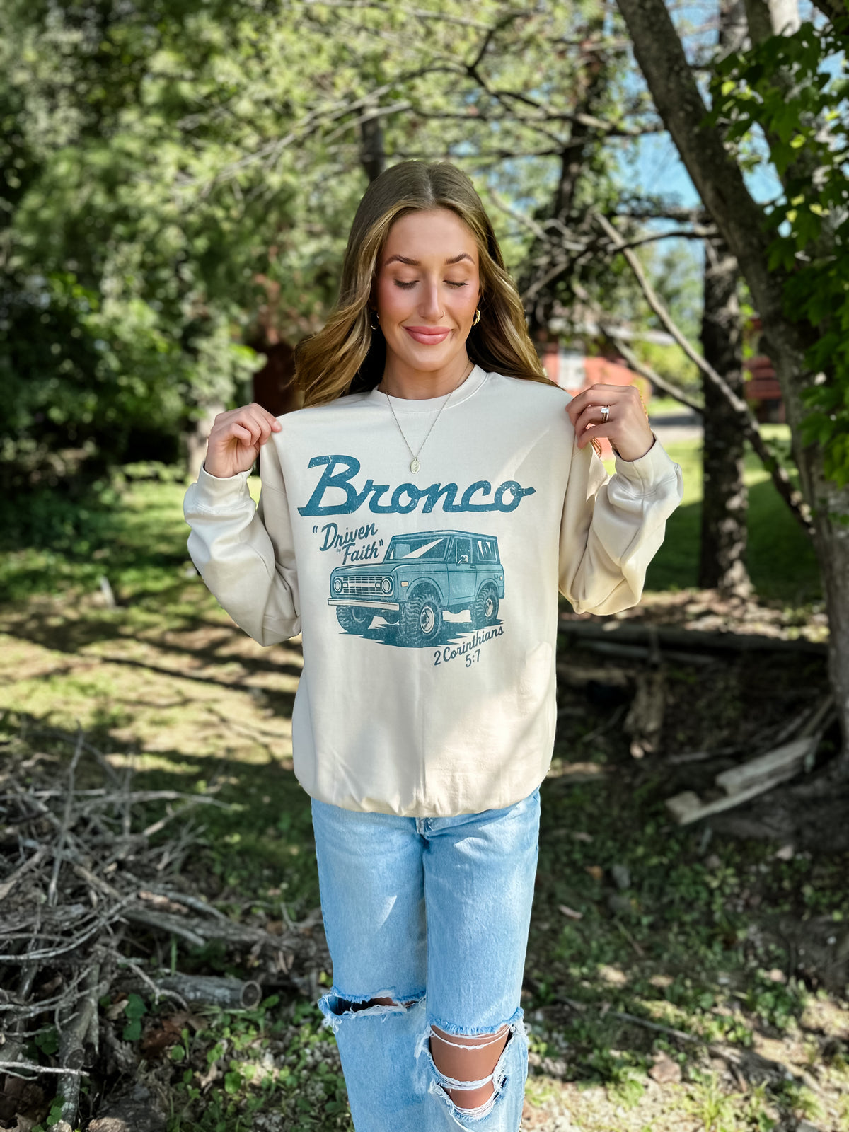 model wearing Driven By Faith Bronco Sweatshirt