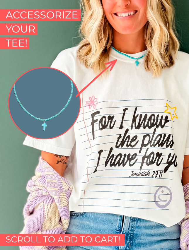 Jeremiah 29:11 tee in white with black text, featuring a handwritten style and colorful accents, worn by a smiling woman.